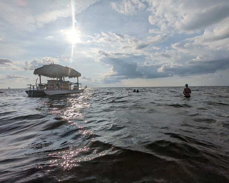 Midday Tiki Boat & Skiff Cruise With Tubing in Salvo, NC